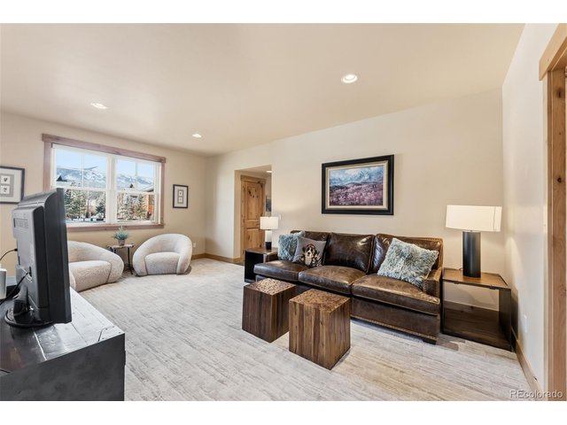 Property Photo 19 Lower level second living area with plenty of space for multiple uses.