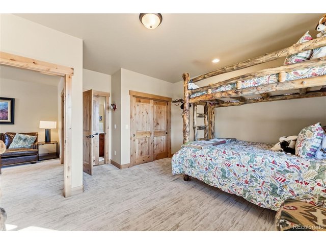 Property Photo 24 Lower level bedroom with en-suite full bath.