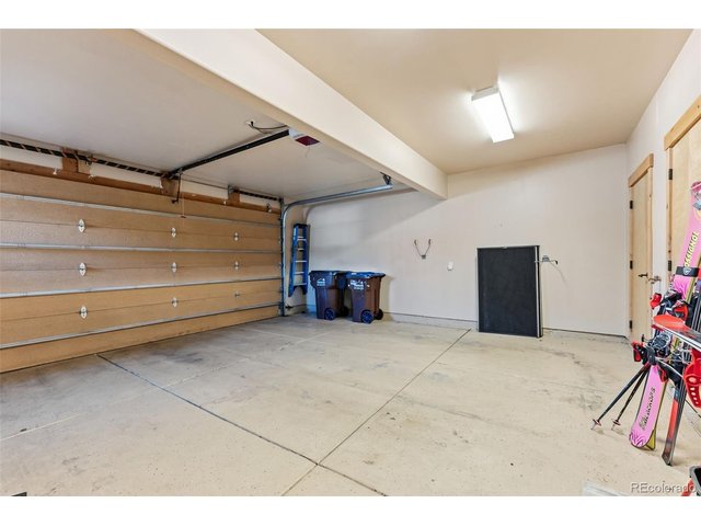 Property Photo 28 Two car garage with storage room and utility room.