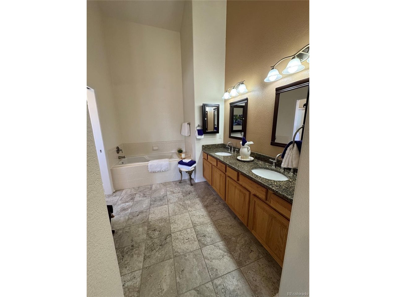 Spacious primary bathroom with large soaking tub.