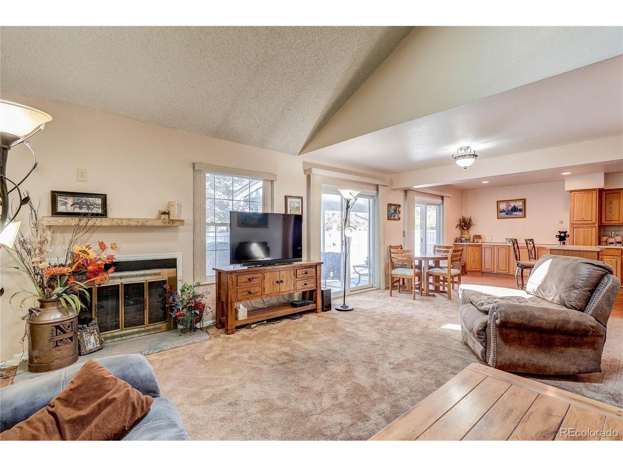 looking northwest into the open dining and kitchen area