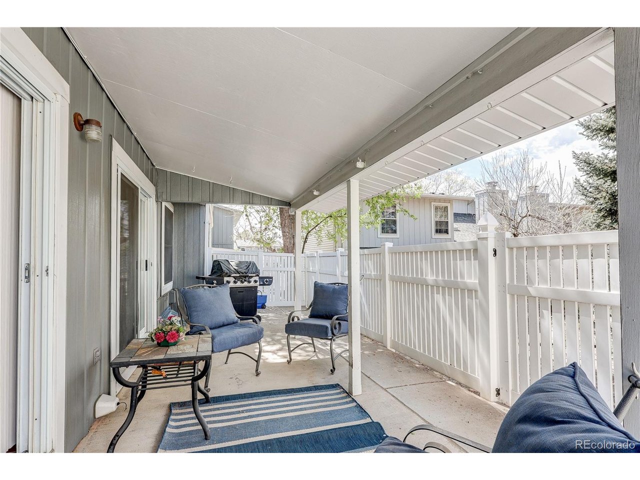 Covered and fenced back patio with extended area for BBQ