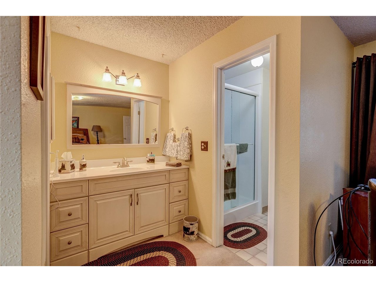 Primary bedroom vanity and shower