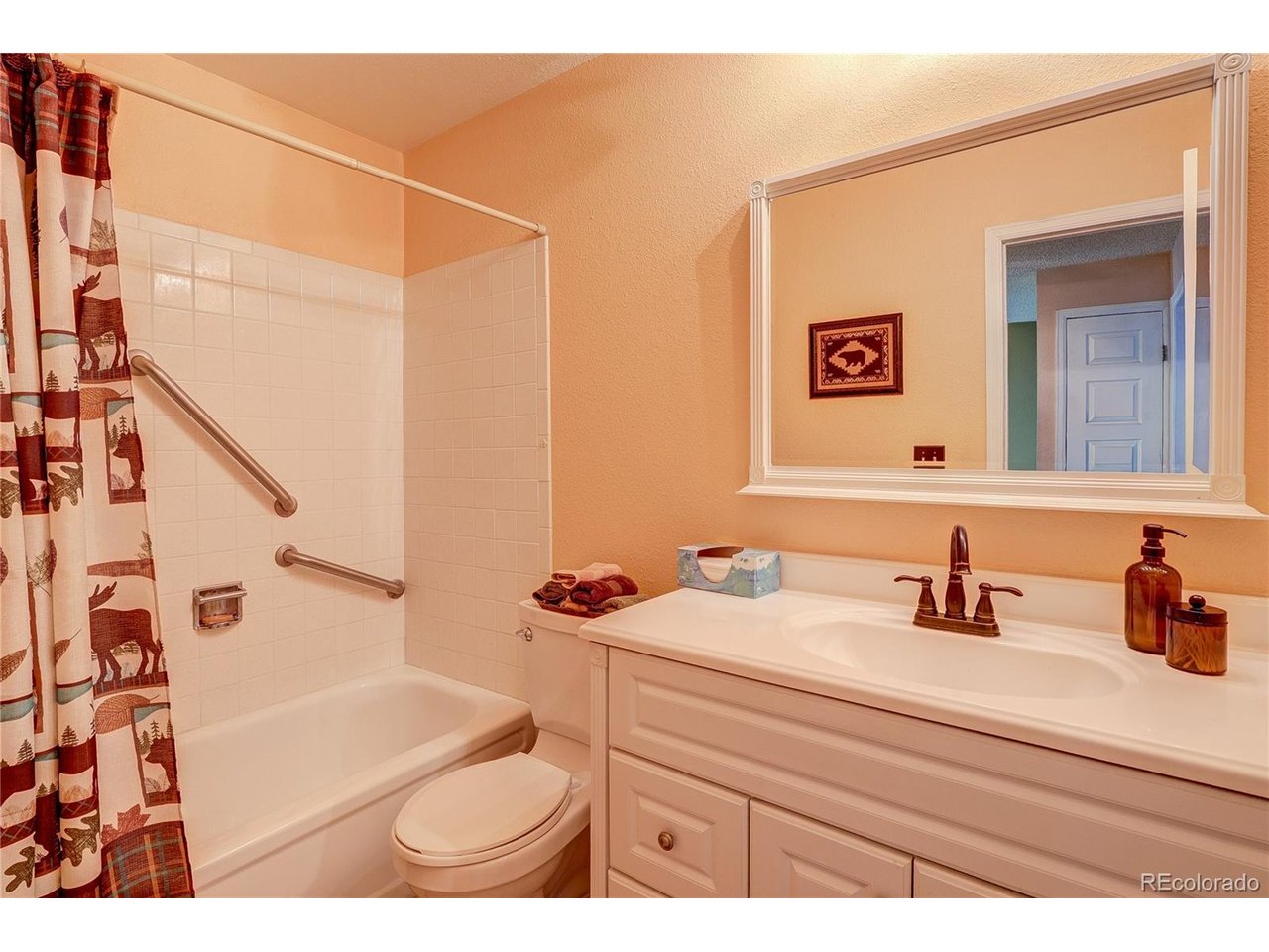 Full bathroom hallway with large vanity and sink area