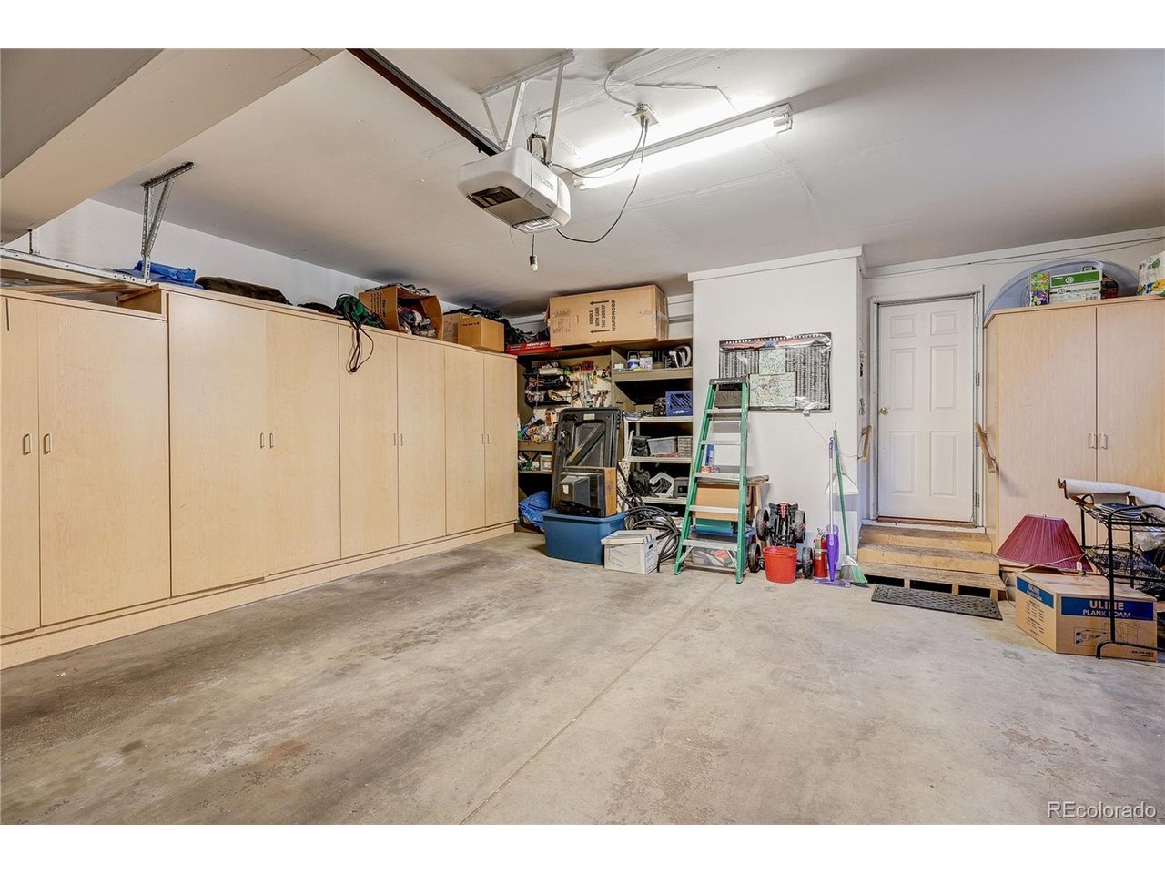 2-car garage with ample storage closets and shelves