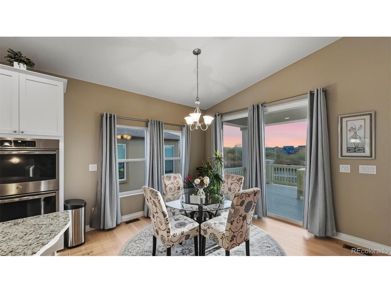 Dining Nook for informal dining with slider to the backyard composite deck.