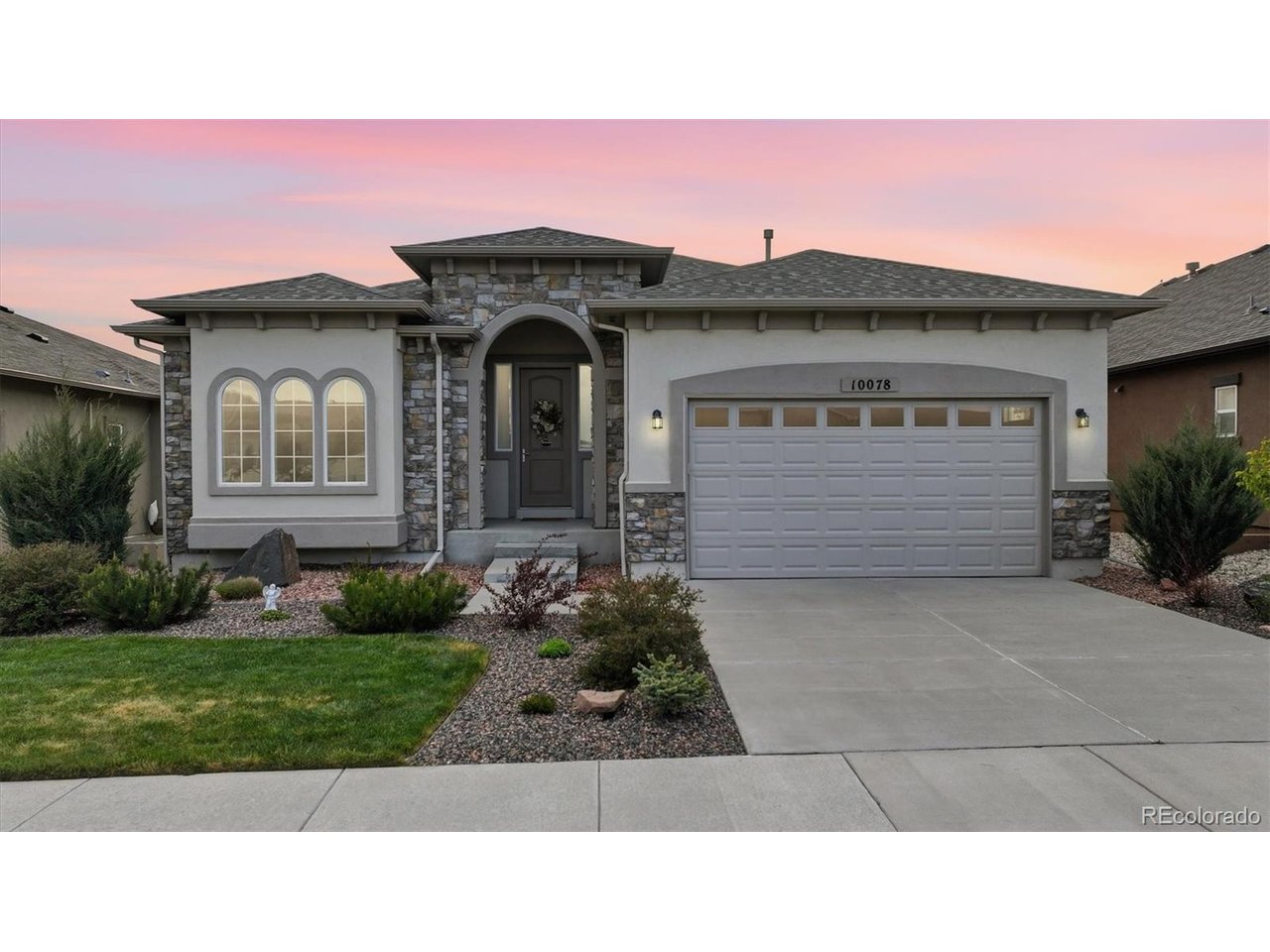 Exceptional curb appeal w/ low-maintenance landscaping, auto sprinklers, & a covered front porch.