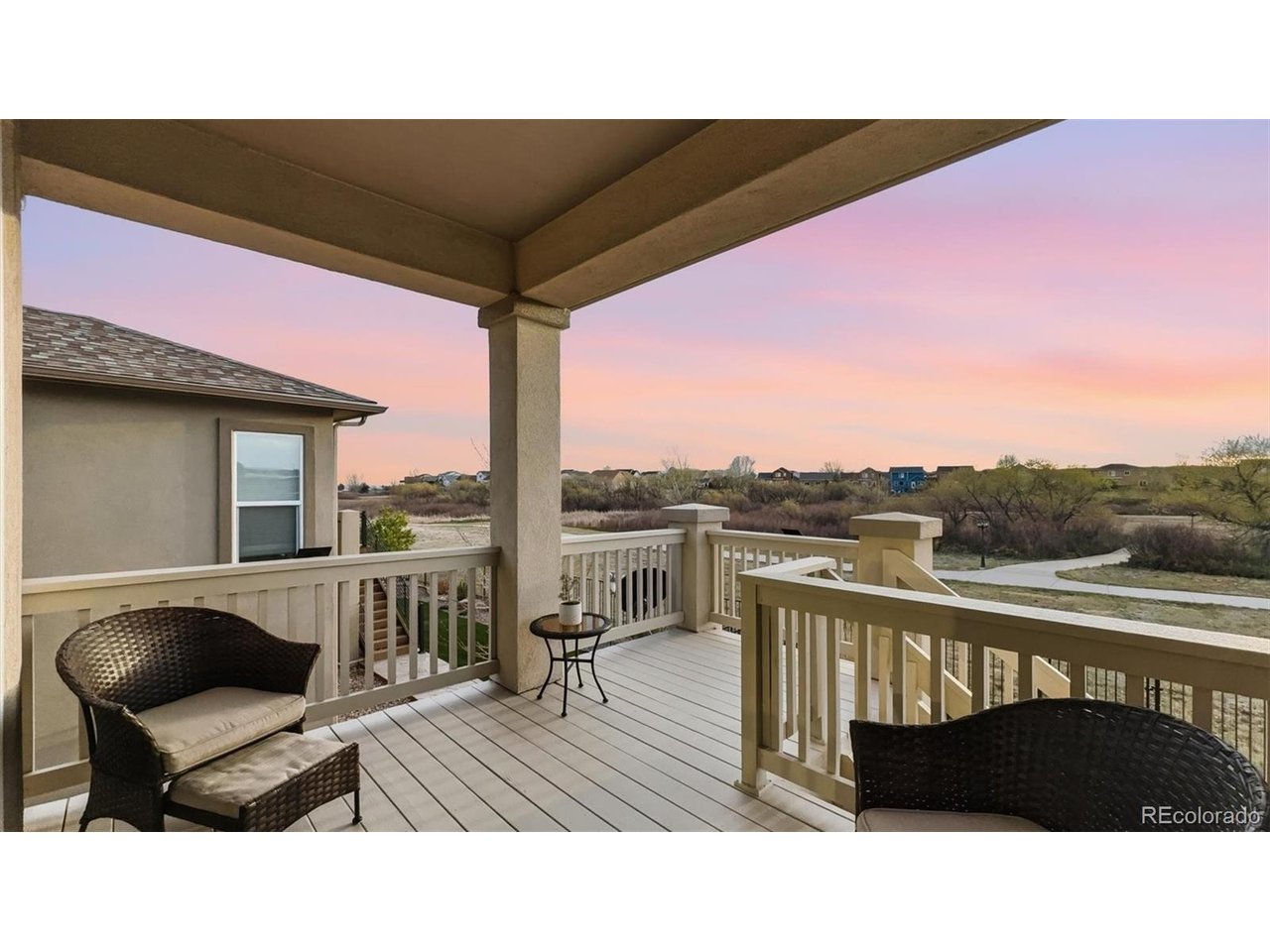 Backyard covered wood deck overlooking community walking trails and Stonebridge Park.