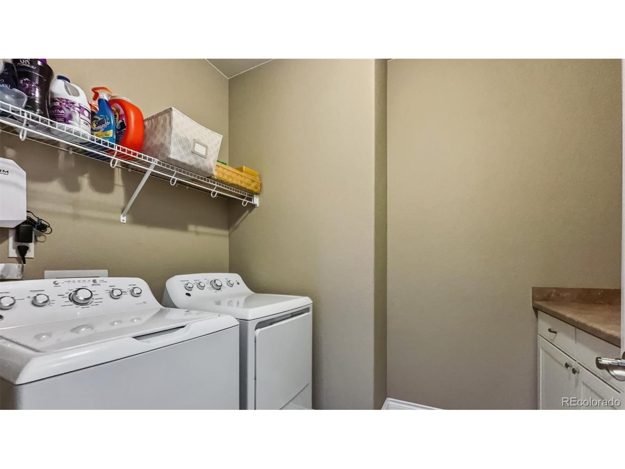The Laundry Room is located off the Primary Bedroom and includes cabinetry and the washer and dryer.