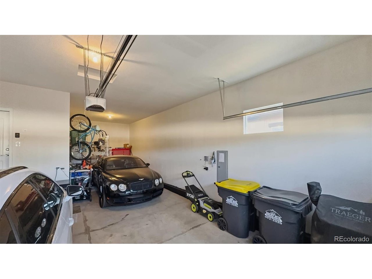 Finished 3-car attached tandem garage with door opener.