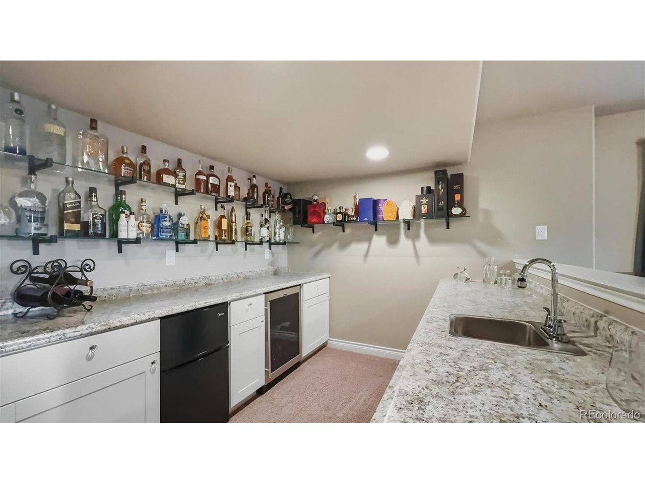 The Basement wet bar is the perfect place for serving your favorite beverages and snacks.