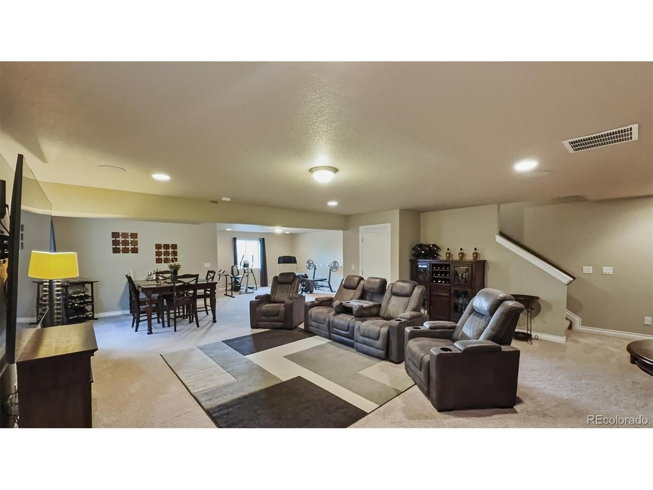 Basement Family/Recreation Room with TV, Dining, and Exercise areas.