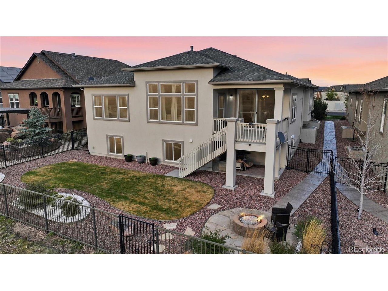 Aerial view of backyard and rear view of home.
