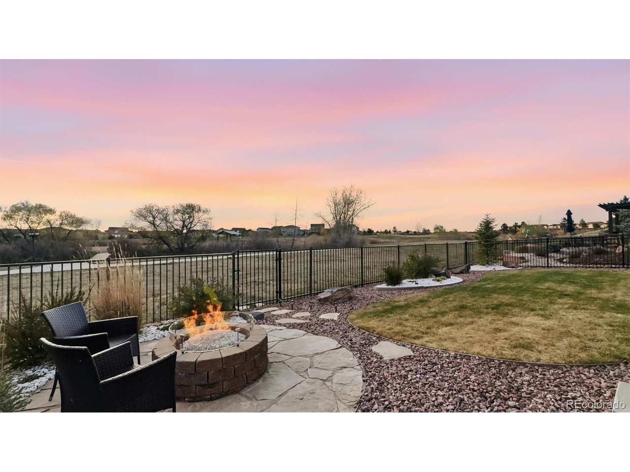 Backyard flagstone patio with firepit and gas valve.