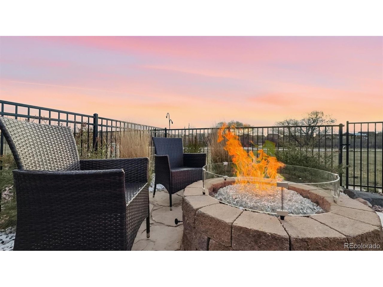 Backyard flagstone patio with gas firepit included.