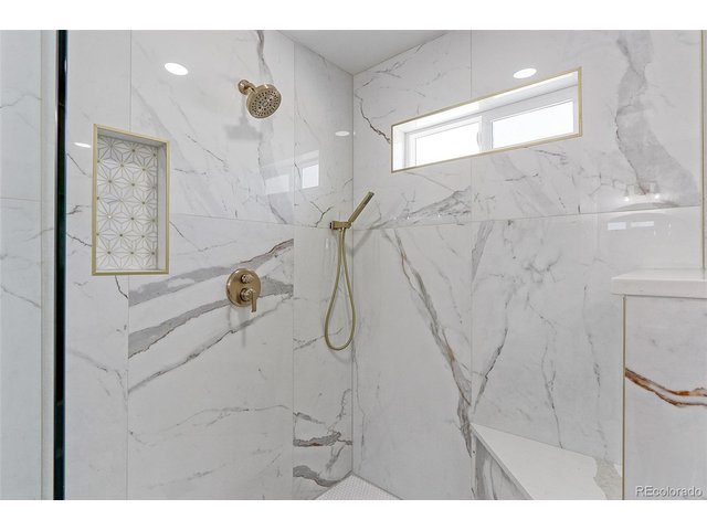 Property Photo 16 Check out the beautiful Marble tile surround in this massive walk-in shower.