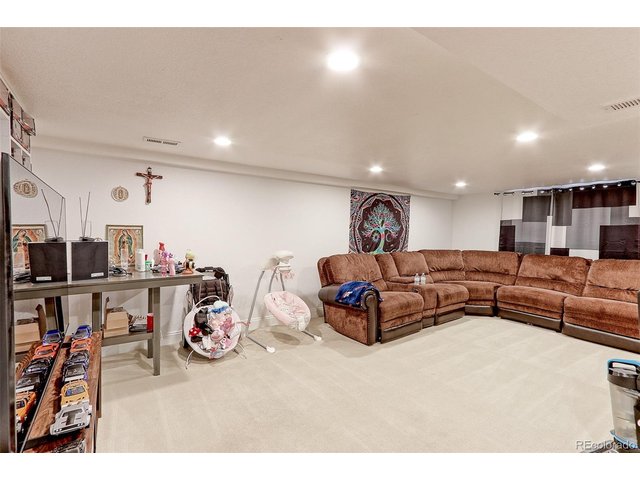 Property Photo 21 This is the view of the Large family and Rec room with tons of overhead recessed LED lighting and newer hi grade carpet. The basement was built out for the Sellers parents to live with him. This is perfect for those that want to have their in-laws live wit