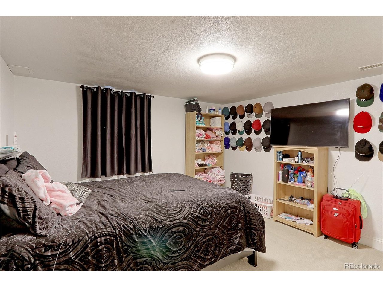 This is the 13x9 Basement 5th bedroom with new egress window, newer carpet, mission style doors and spacious closet with built-in shelving.