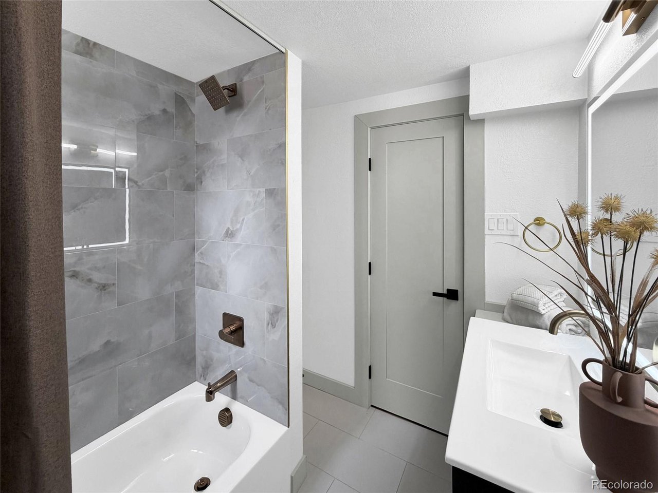 bASEMENT BATHROOM WITH TUB AND CUSTOM TILE!