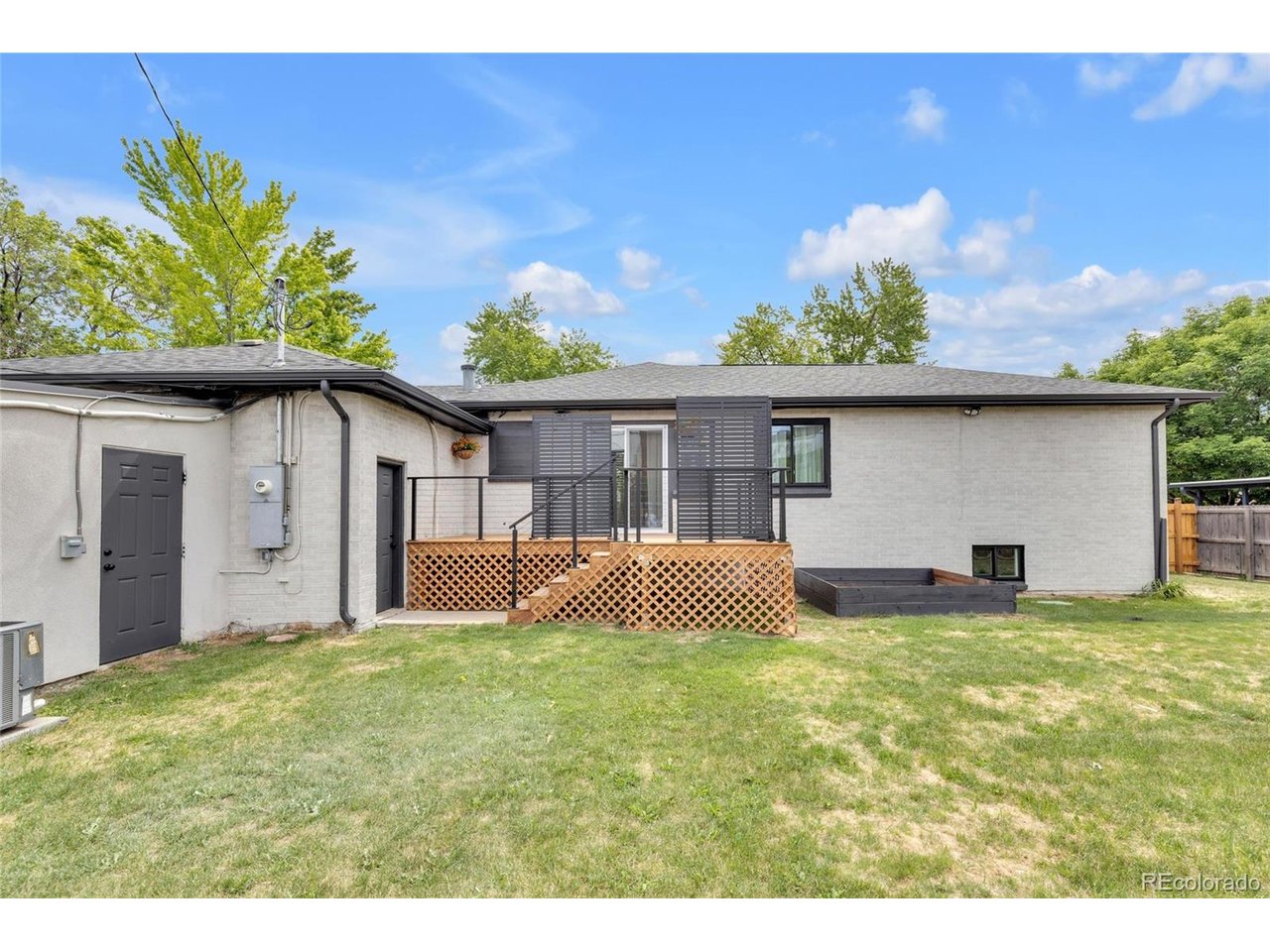 LARGE BACKYARD WITH A DECK AND SHED AND 2 CAR GARAGE.