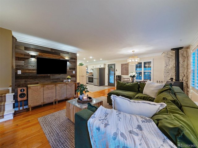 Property Photo 5 Bright, open living room flowing into dining room