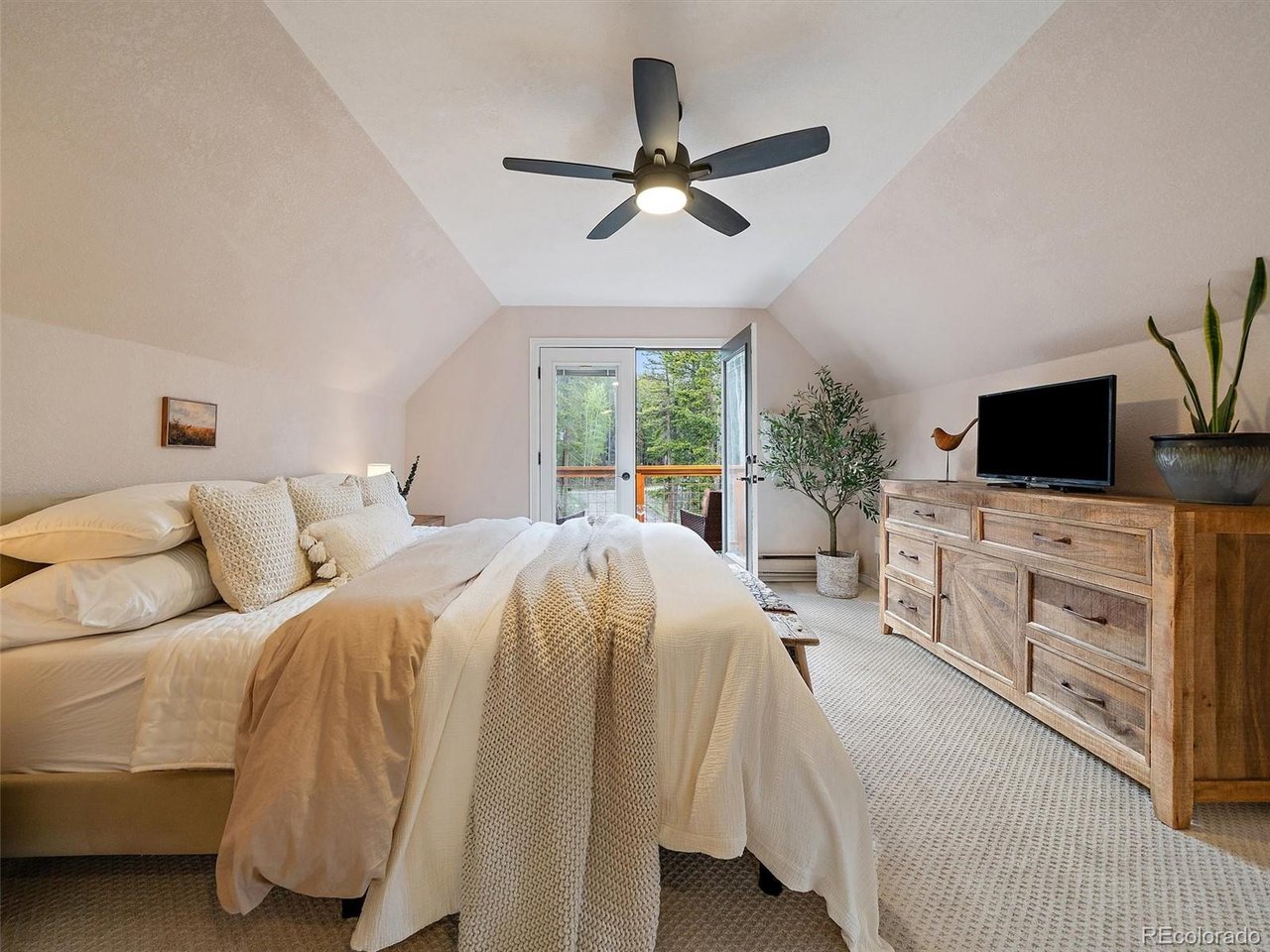 Upper-level bedroom with private balcony & forest views, ( bedroom 2 of 3) Now used as Primary