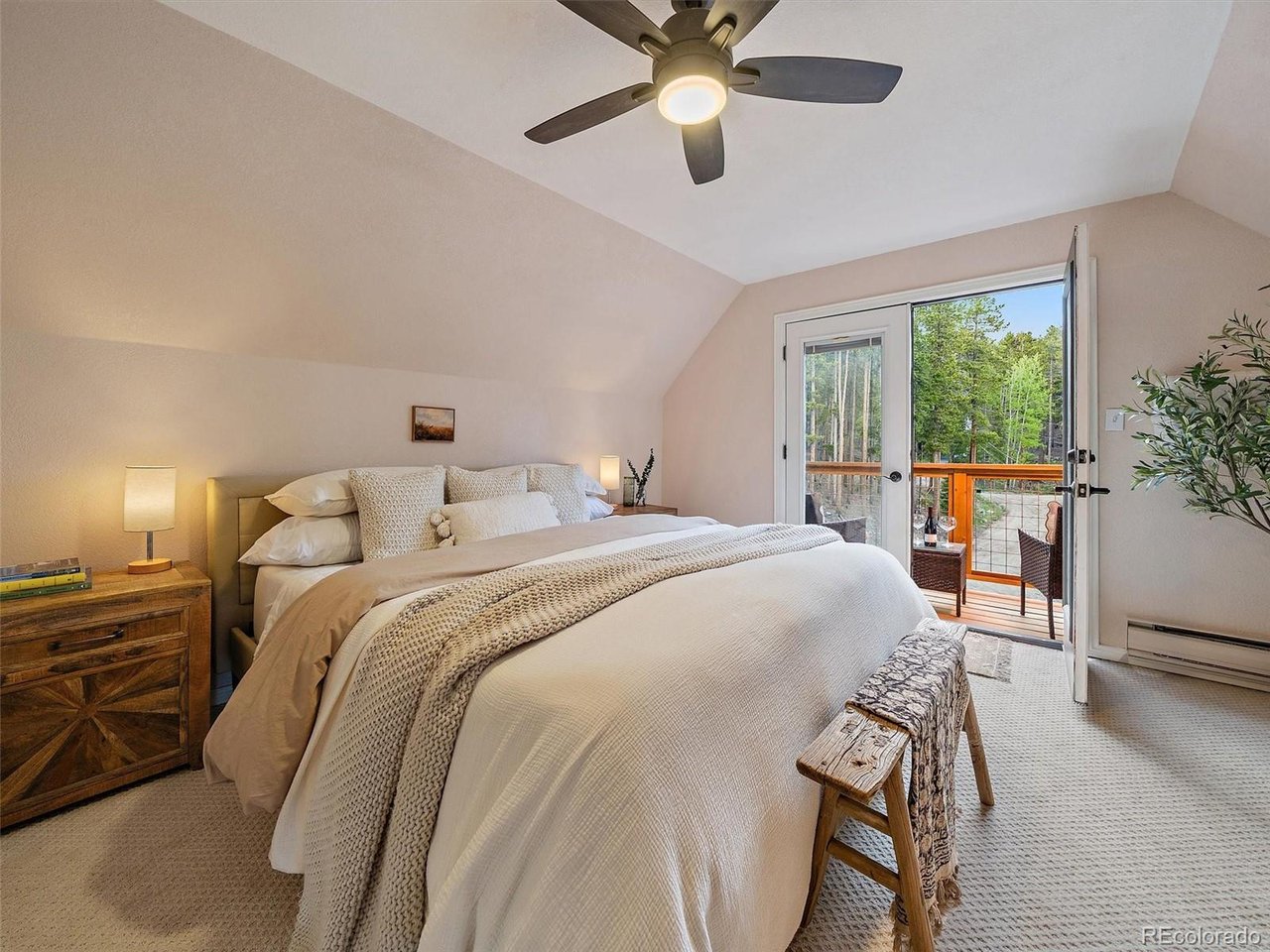 Upper-level primary bedroom with private balcony