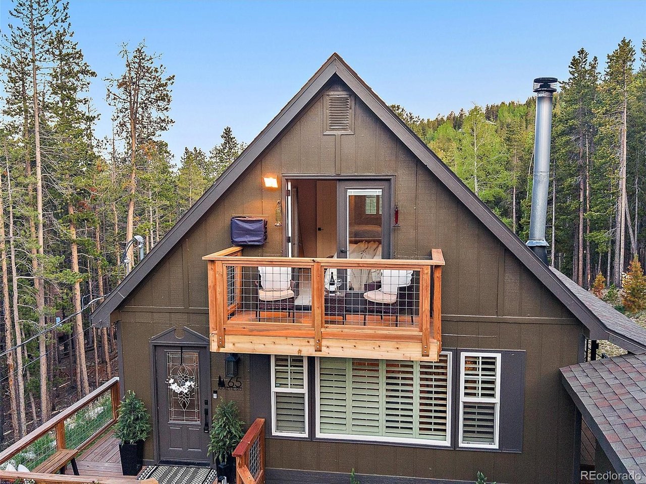 Front Exterior - primary bedroom balcony