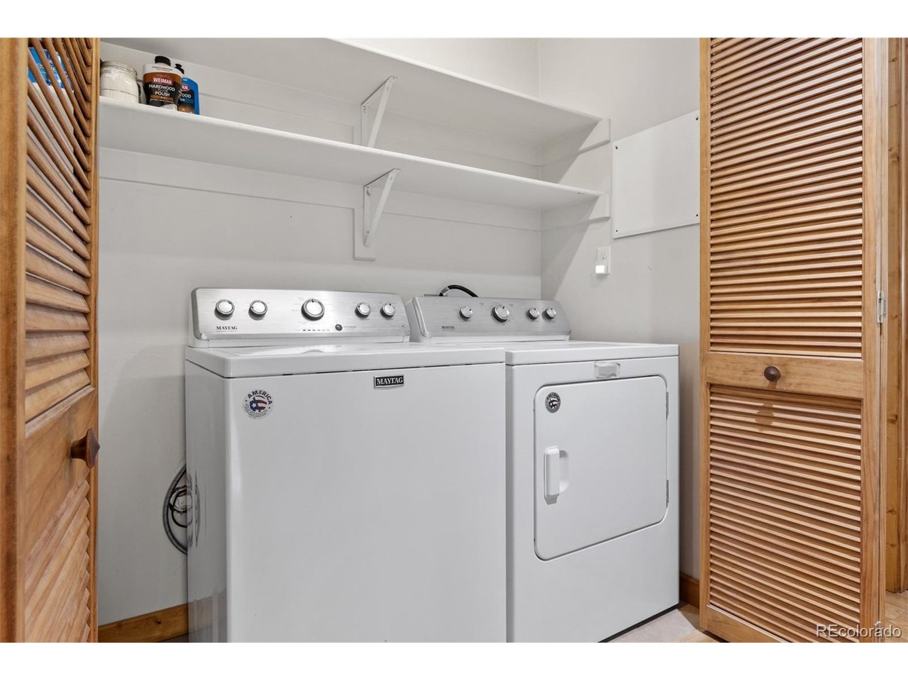 laundry closet with storage