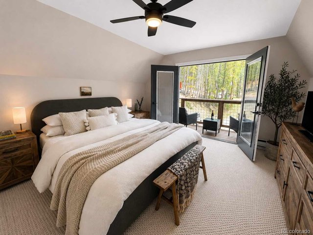 Property Photo 15 Upper-level bedroom with private balcony! Bedroom 2 of 3 now used as Primary